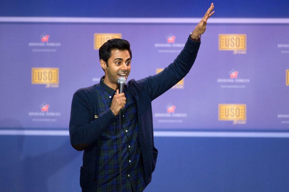 Picture of comedian Hasan Minhaj performing a comedy show