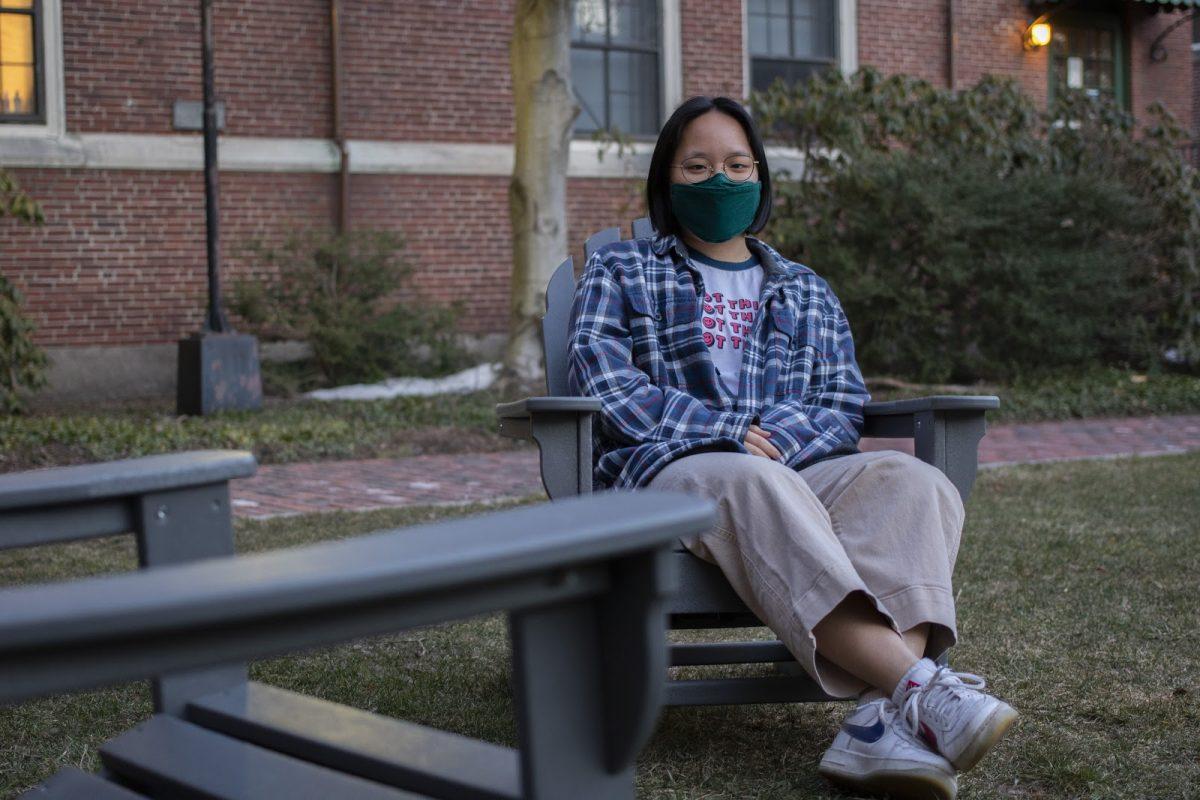Joy Li ’23 sits outside Cazenove Hall, where she has lived nine of the past twelve months
(Photo by Macy Lipkin)