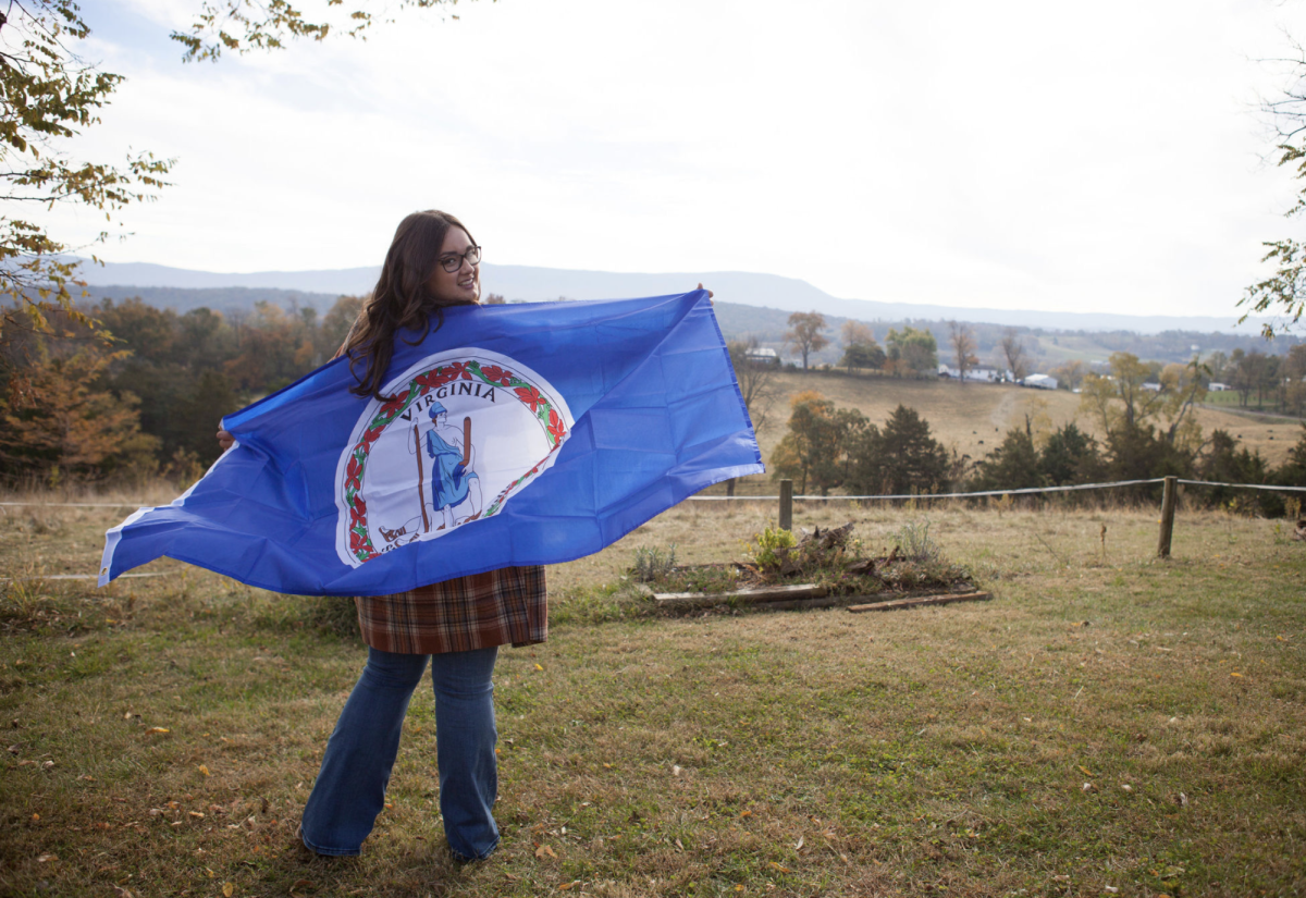 Abby Garber with the Virginia flag. Photo courtesy of Abby Garber.